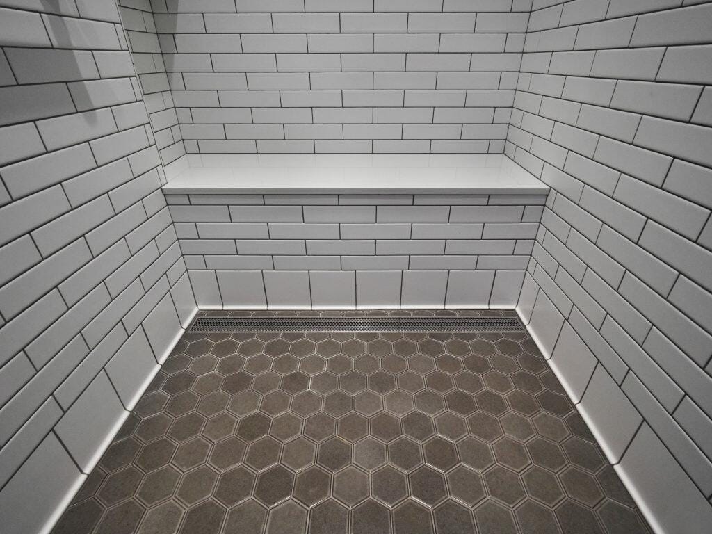 britton-master bath floor and bench