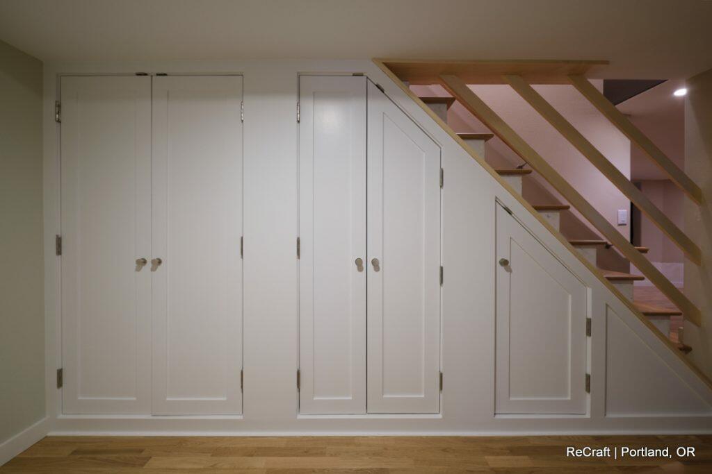 suchard yabkowitz-built-ins Basement Under Stair Storage Remodel
