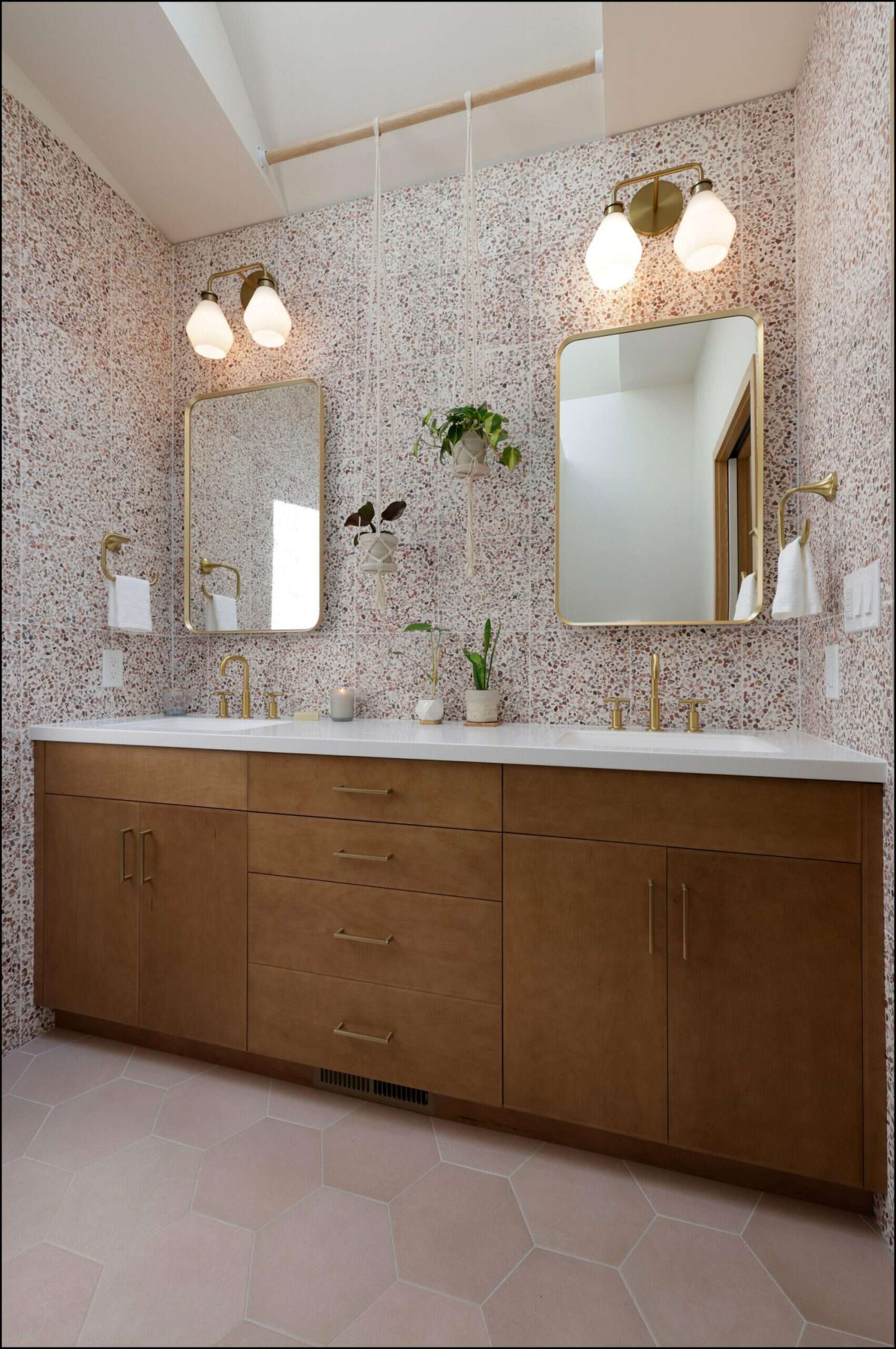 Modern bathroom vanity with dual mirrors, stylish lighting, and natural accents, showcasing ReCraft Home Remodeling's design in a Portland bathroom renovation.