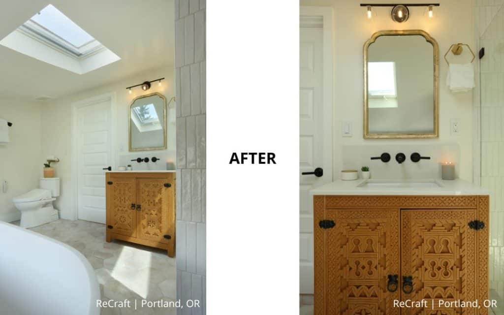 A renovated bathroom with a carved wooden vanity, rectangular mirror, white walls, and modern fixtures under bright natural light. Text reads "AFTER - ReCraft | Portland, OR—award-winning addition by Remodeler of the Year.