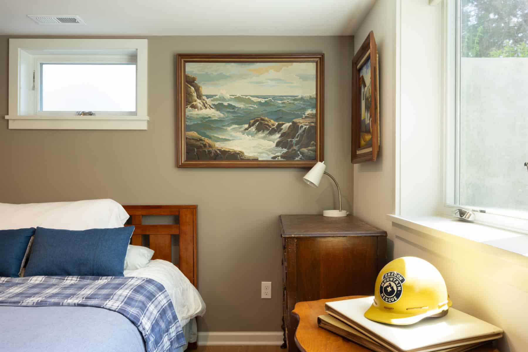 Finished basement renovation with cozy bedroom and decor details.