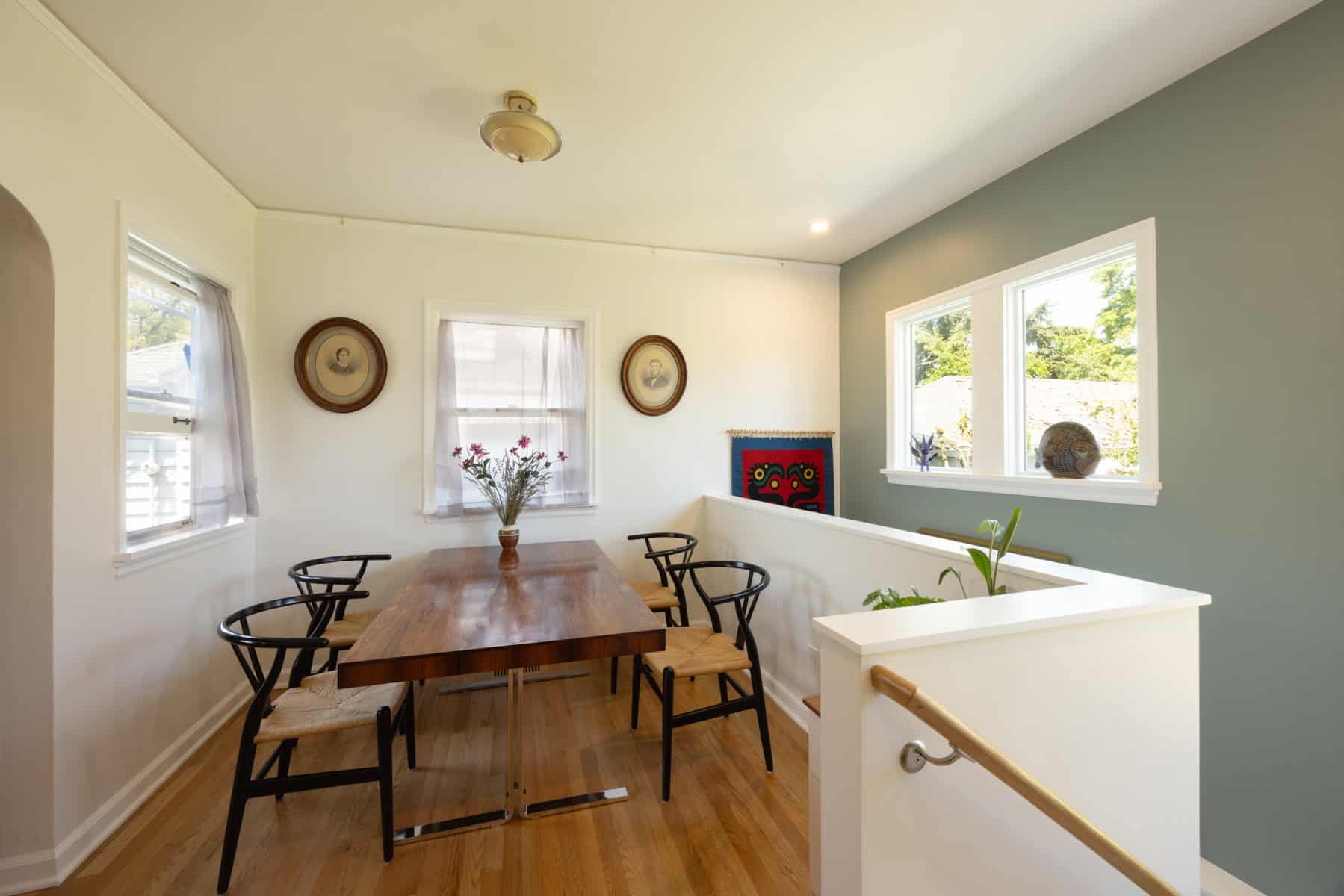 Finished basement remodel with dining area and staircase in Portland, Oregon.
