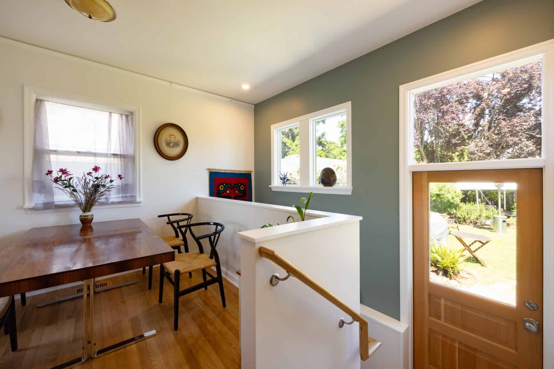 Finished basement renovation with wood table and chairs, Portland Oregon.